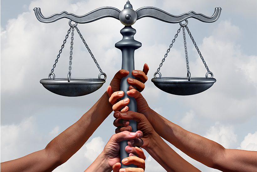 hands holding the scales of justice