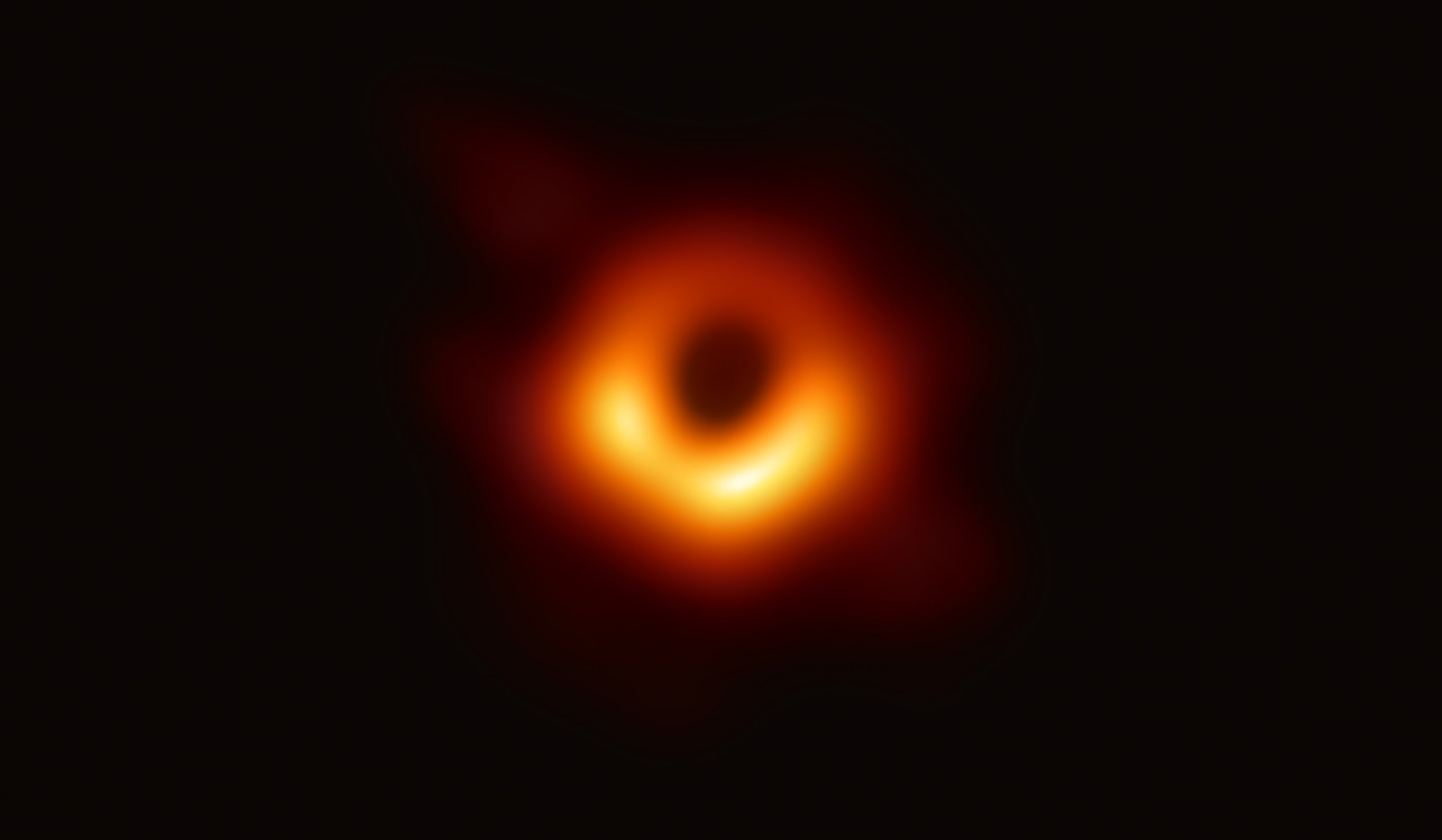 Blurry orange ring against a black backdrop