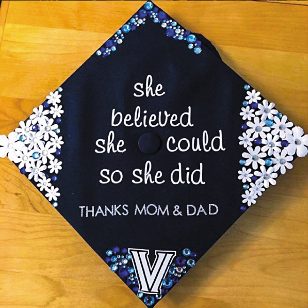 Flowered and jeweled cap that reads: “She believed she could so she did. Thanks Mom & Dad.”