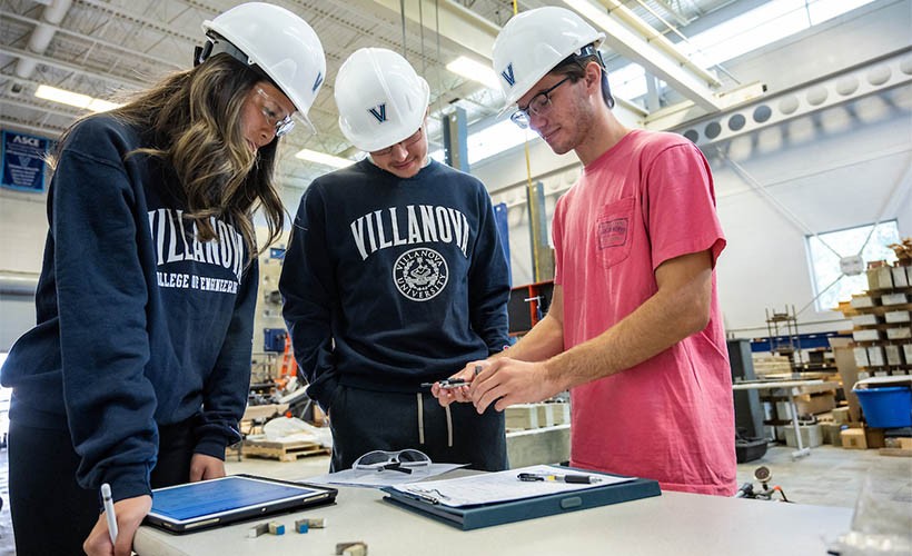 Students in hardhats in Villanova's Structures Lab