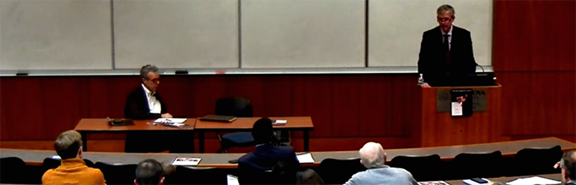 screenshot of a recorded lecture in a large seminar room