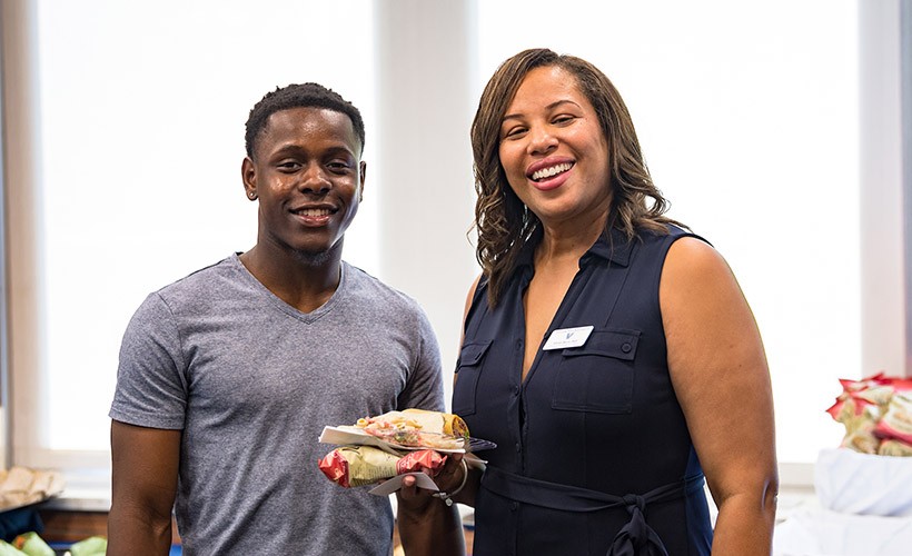 Eloise Berry and a student pose for a picture at the Multicultural Student Reception.