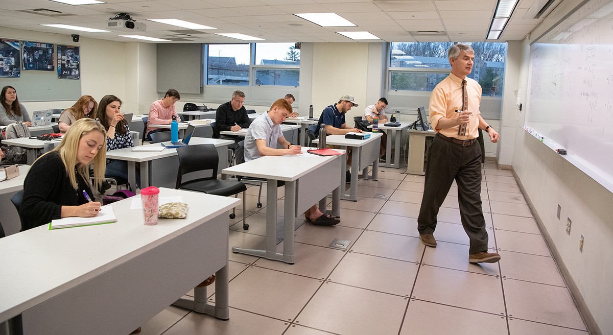 Professor instructs his graduate mathematics class
