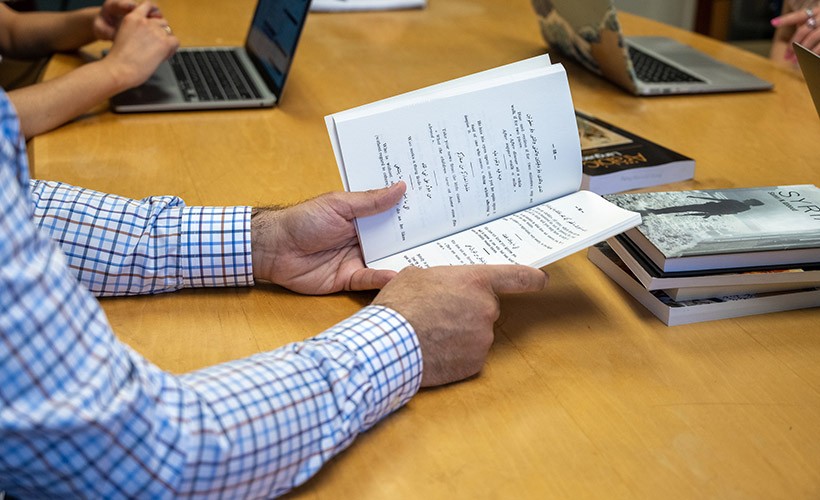 A close up of an Arabic language book. A close up of an Arabic language book.