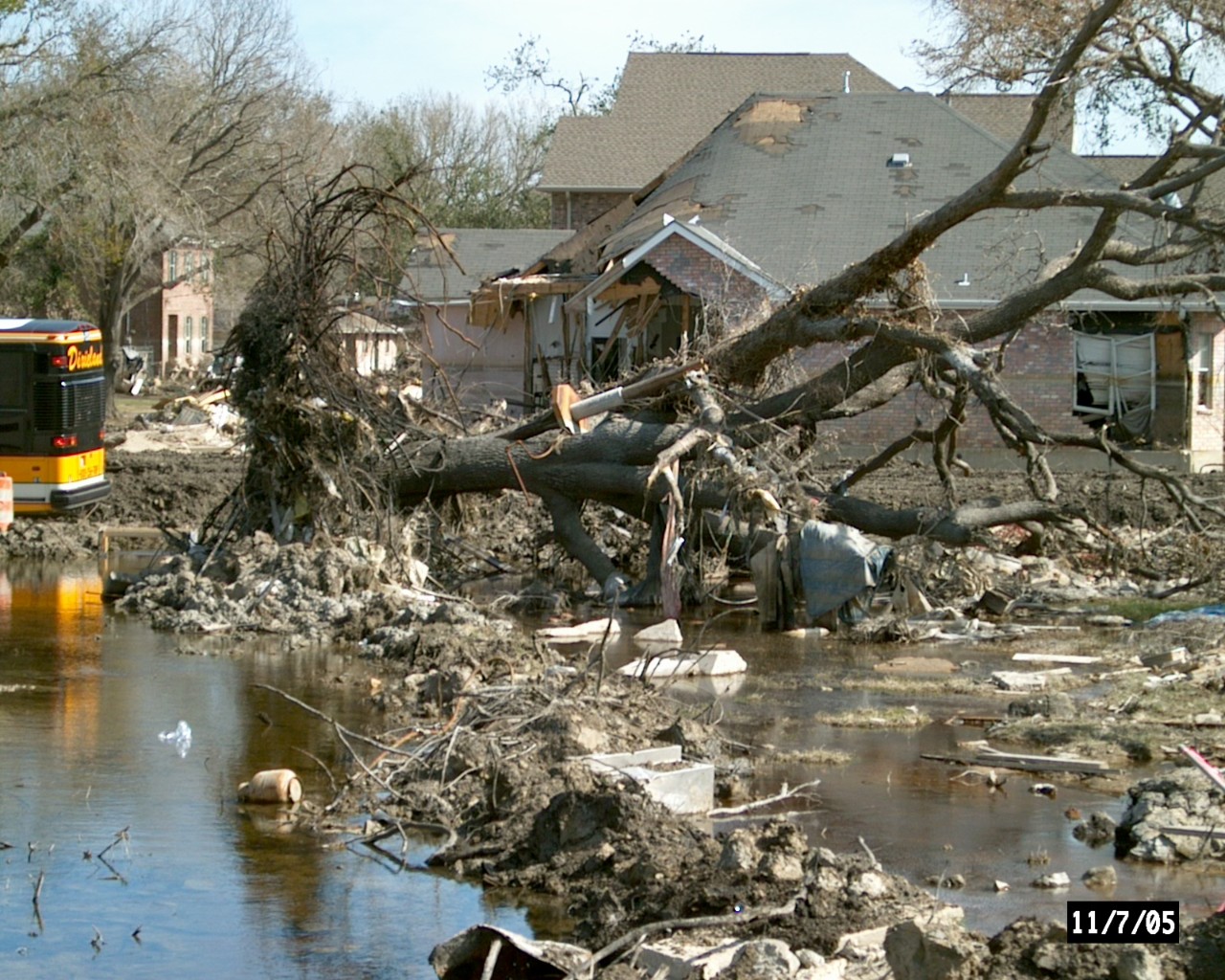Destruction to a home by flooding and a downed tree. Destruction to a home by flooding and a downed tree.
