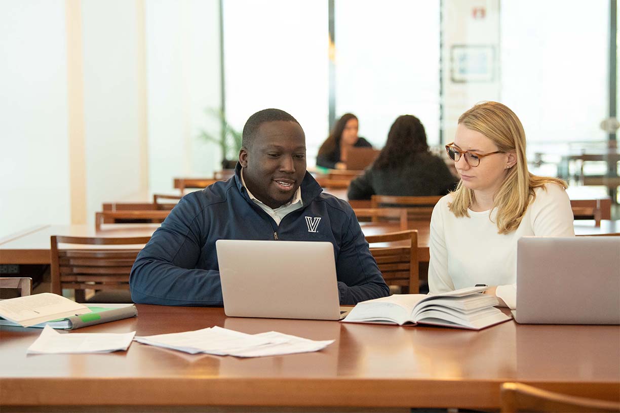 Two graduate students studying