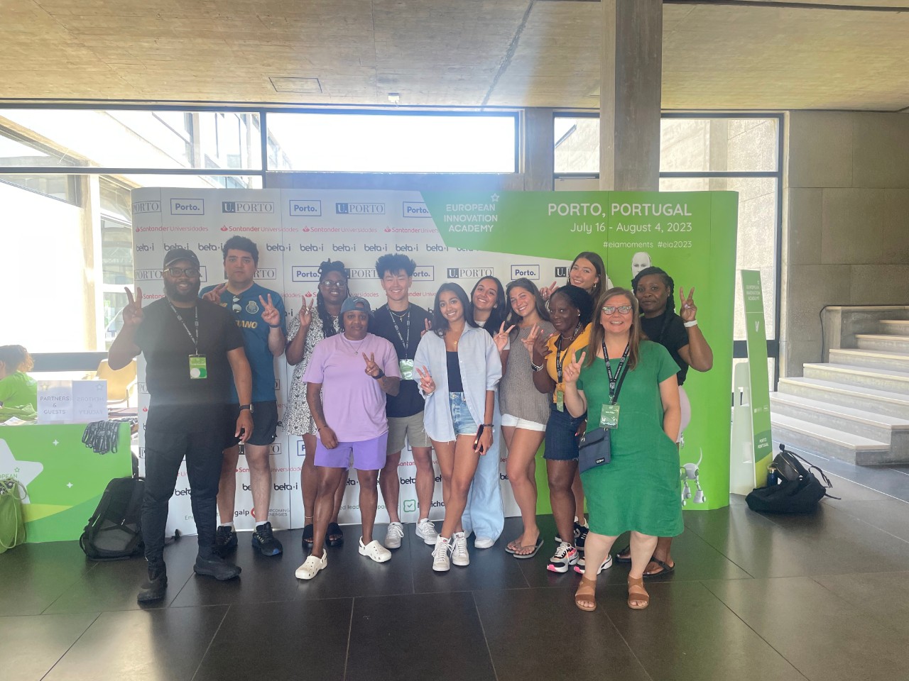 Villanova students pose in front of sign for European Innovation Academy in Porto, Portugal