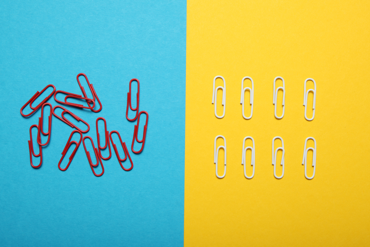 split screen of disorganized and organized paperclips