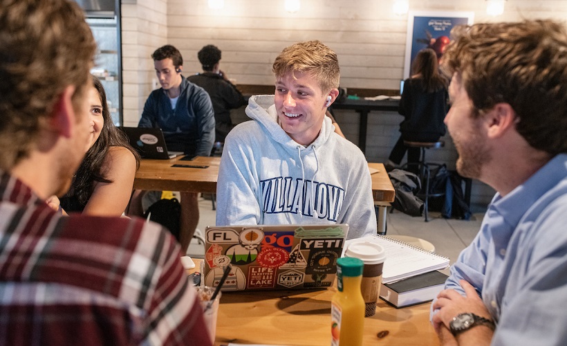 Students chatting at Holy Grounds coffee shop