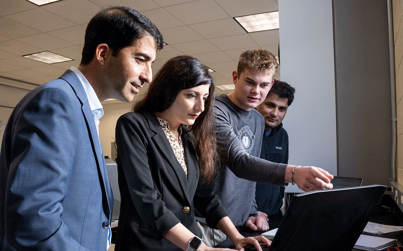 Mojtaba Vaezi, PhD, working with students and colleagues in the laboratory